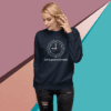 Woman wearing a navy sweatshirt with a clock graphic and text.