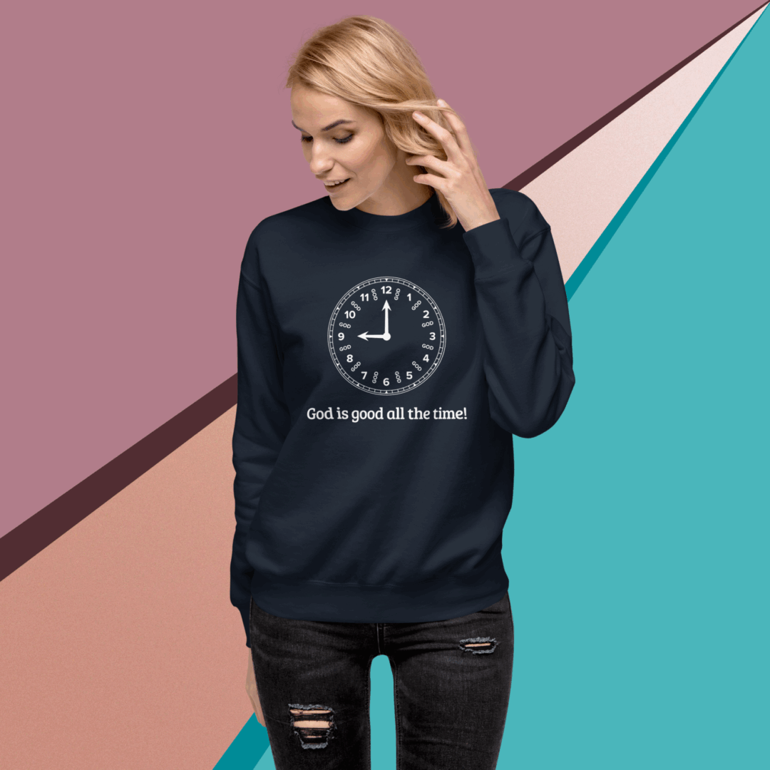 Woman wearing a navy sweatshirt with a clock graphic and text.