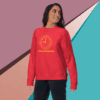 Woman in red sweatshirt with motivational text smiling confidently.