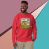 Man wearing a red sweatshirt with a colorful dinosaur illustration.