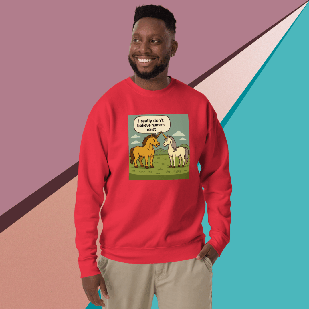 Man wearing a red sweatshirt with a colorful dinosaur illustration.