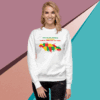 Woman wearing a white sweatshirt with a colorful map of North Carolina.