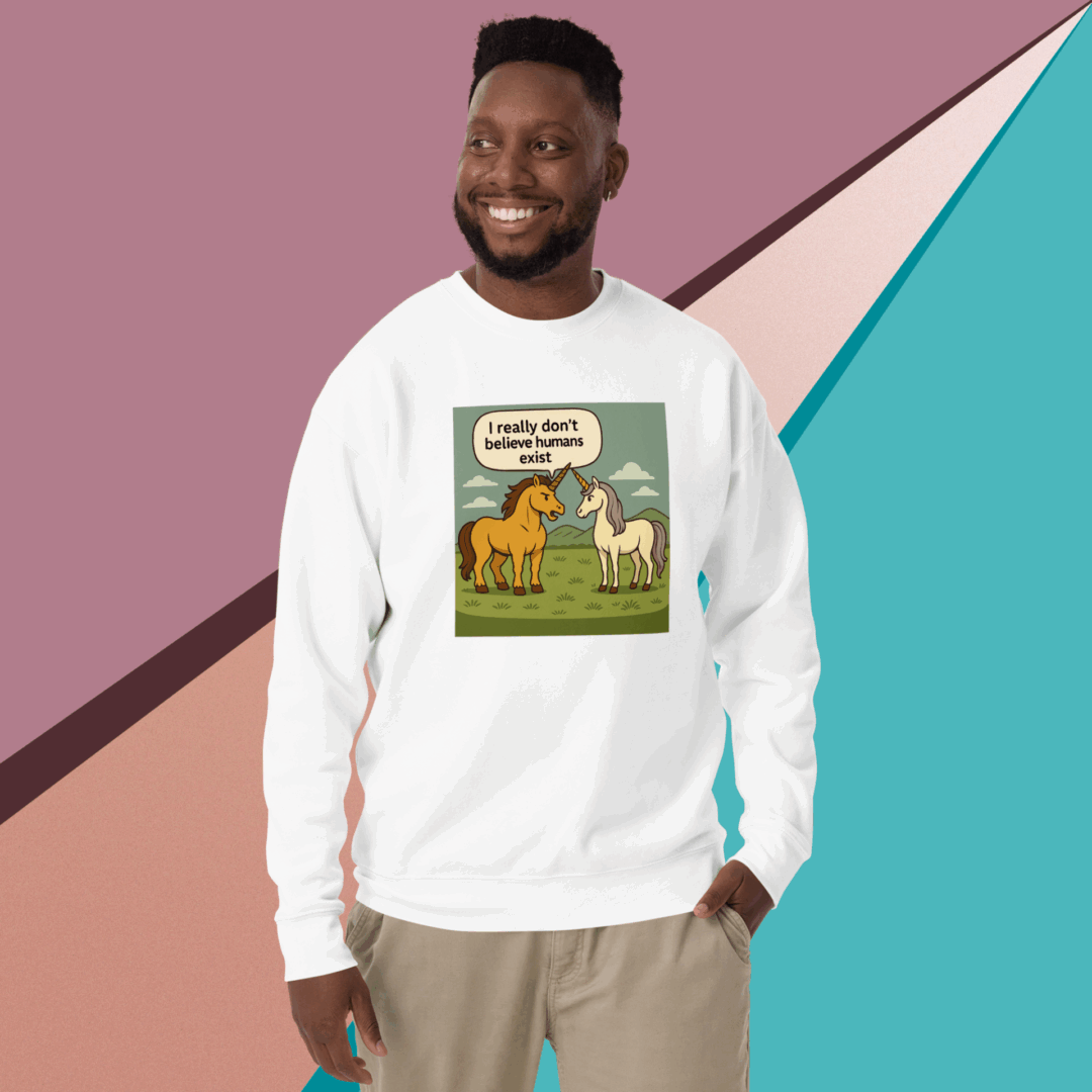 Man wearing a white sweatshirt with a cartoon dinosaur design.