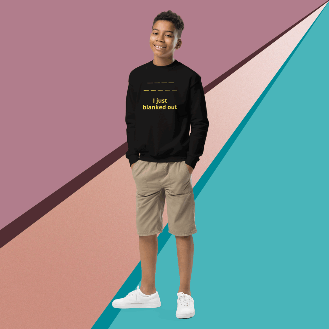 Young man in casual wear posing against a colorful geometric background.
