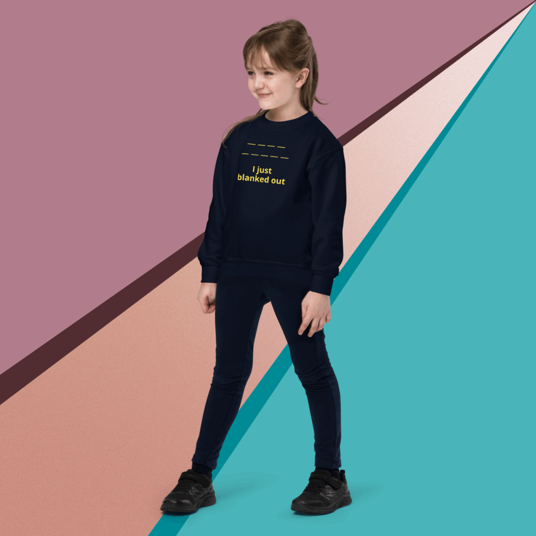 Young girl in casual black outfit standing against a geometric colorful background.