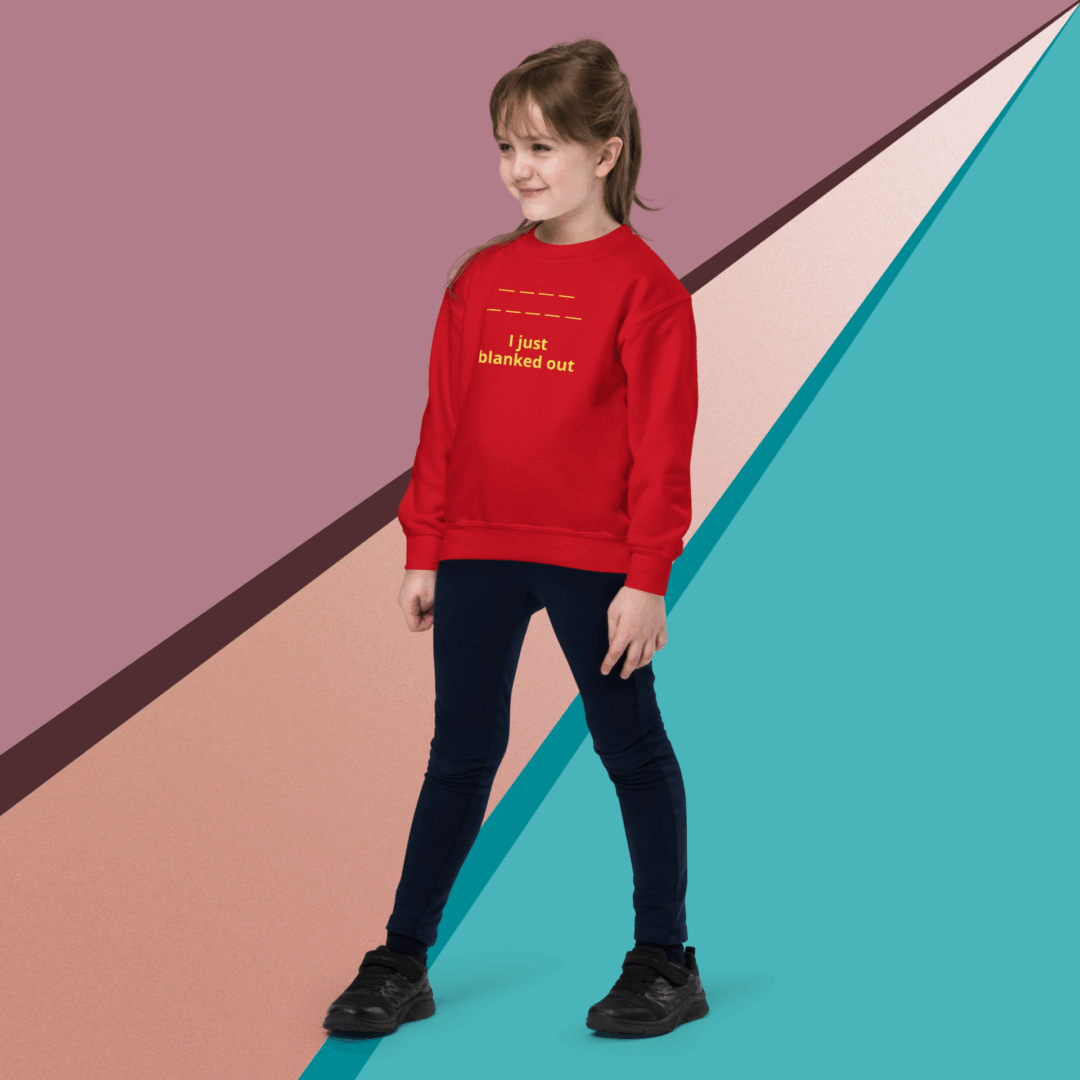 Young girl in a red sweater standing confidently against a colorful geometric background.