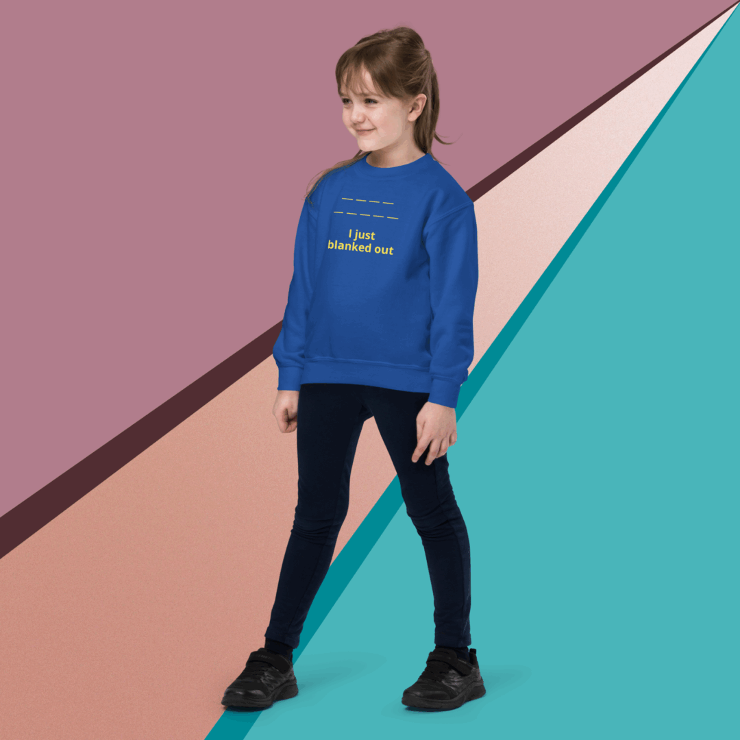 A young girl in a blue sweatshirt and black pants poses against a colorful geometric background.