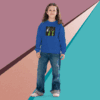A young person in a blue sweatshirt and jeans stands against a colorful geometric background.