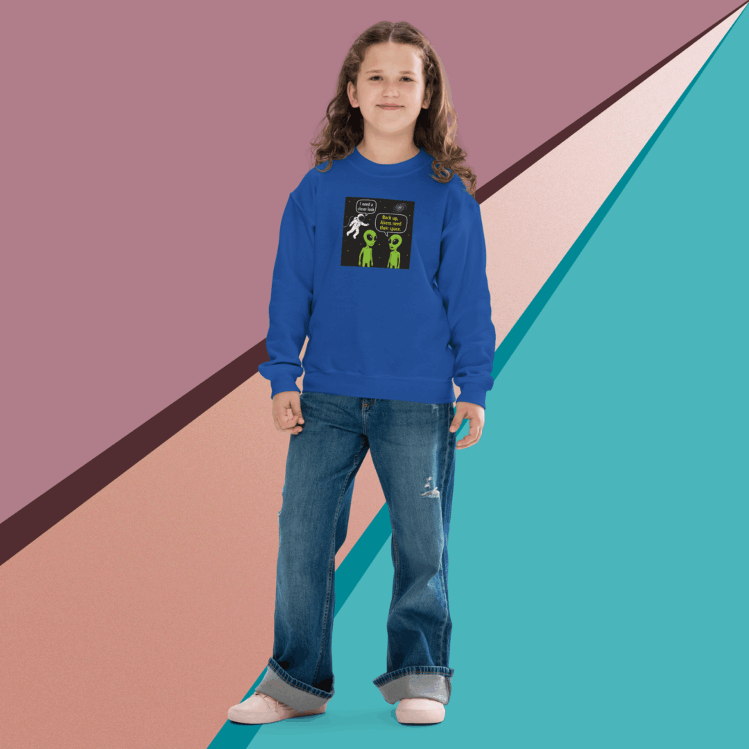 A young person in a blue sweatshirt and jeans stands against a colorful geometric background.