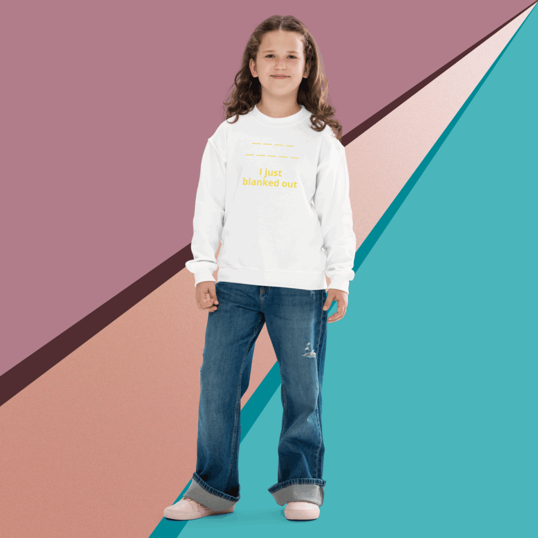 Young girl posing in a white hoodie and jeans against a colorful geometric background.