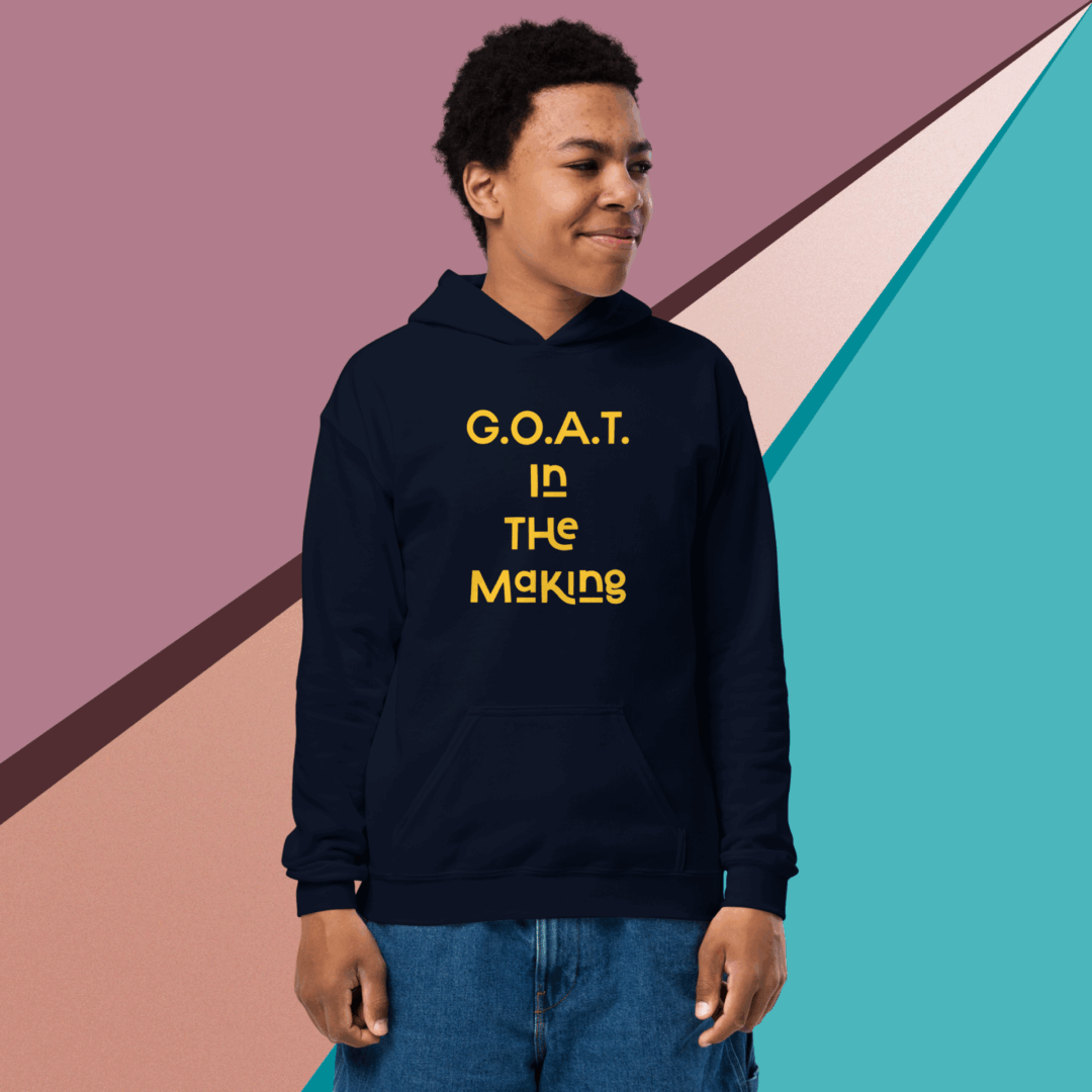 Man wearing a black hoodie with 'G.O.A.T IS THE MONKIES' text.