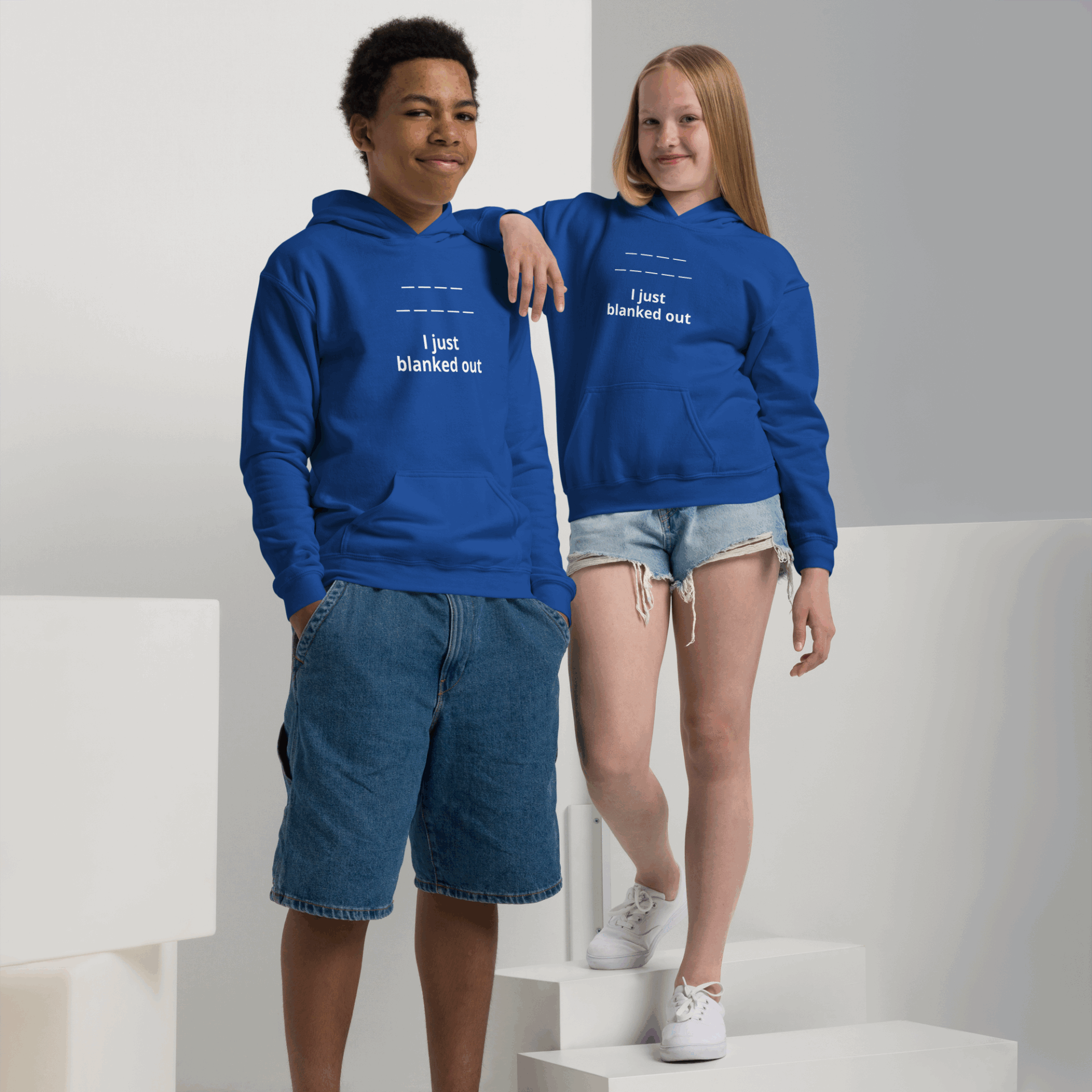 Two teens wearing matching blue hoodies that say 'I just blanked out'.
