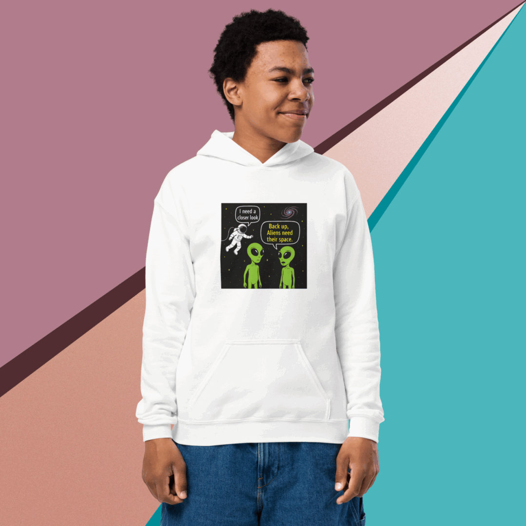 A smiling young man wearing a white hoodie with a colorful graphic design.