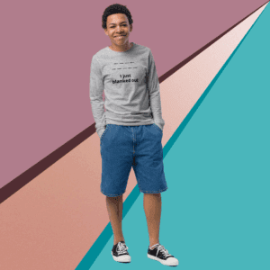 Young man in casual outfit standing against a colorful geometric background.