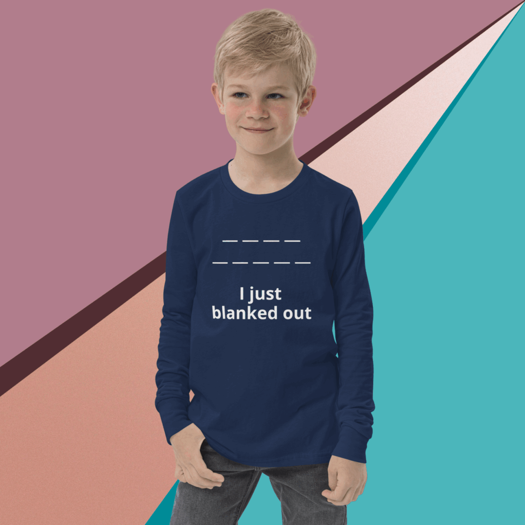 Young boy in a navy blue shirt with text, standing against a colorful geometric background.