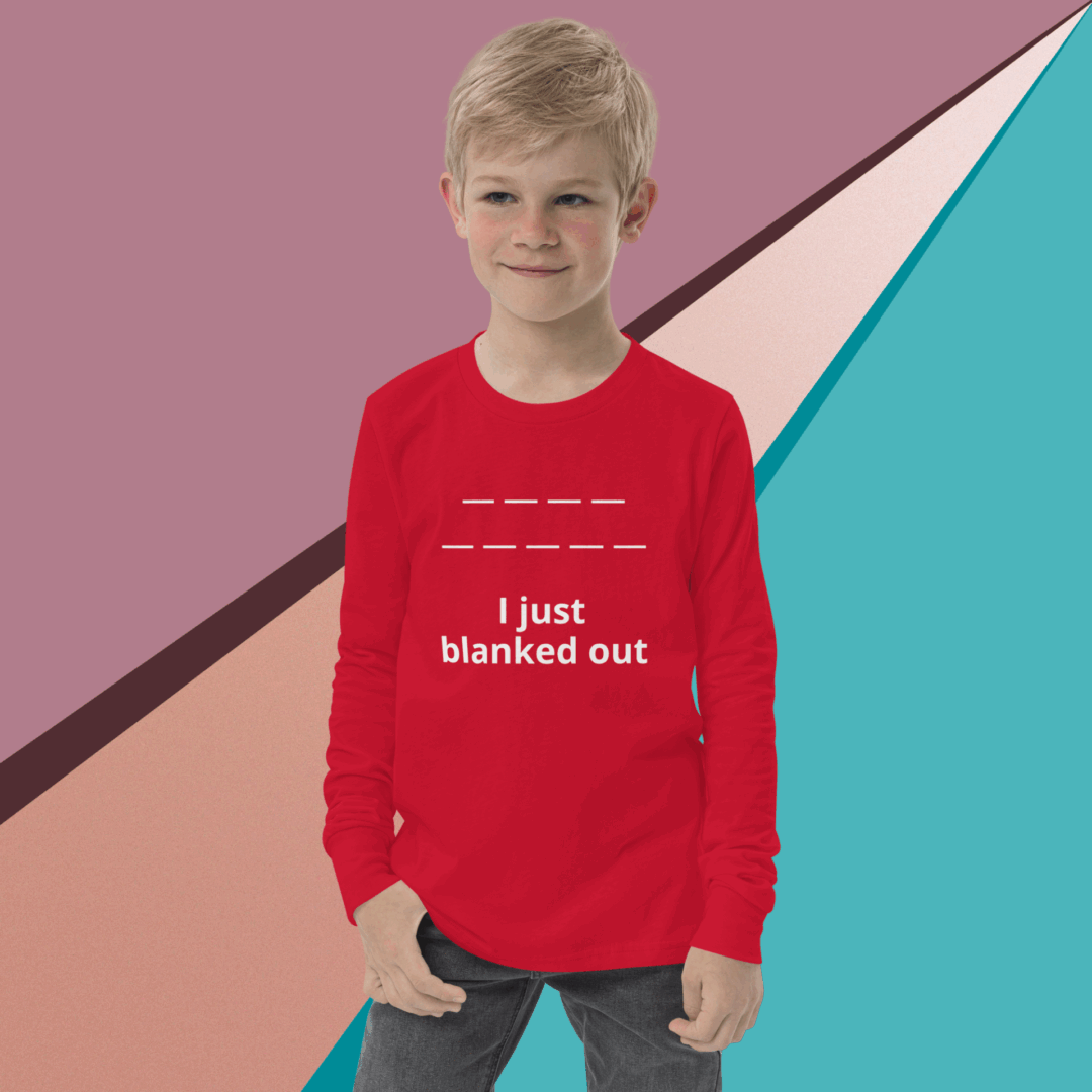 Young boy wearing a red shirt with a humorous text.